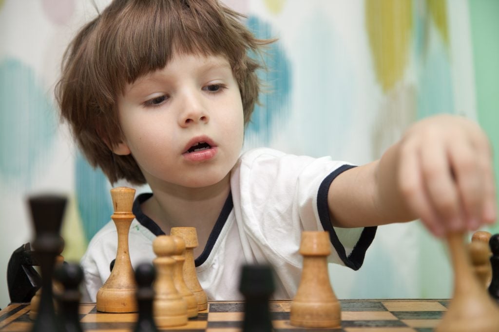 Sevenyearold Boy European Appearance Plays Chess Stock Photo